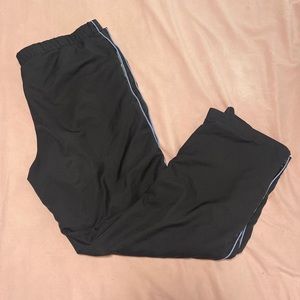 Black trackpants with blue trim
